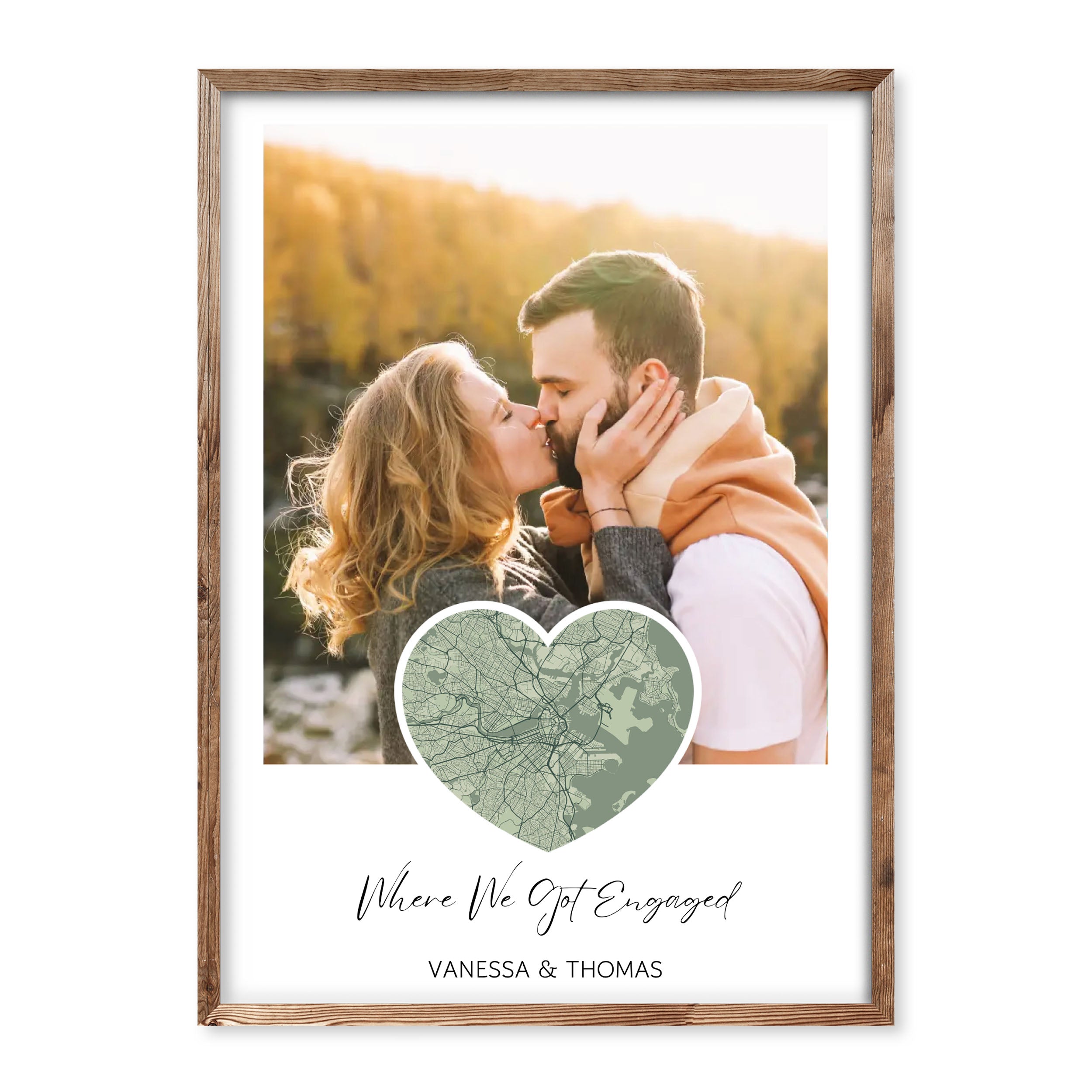 Personalised engagement map poster with photo, heart-shaped map in green, couple kissing, caption “Where We Got Engaged” with names Vanessa & Thomas.