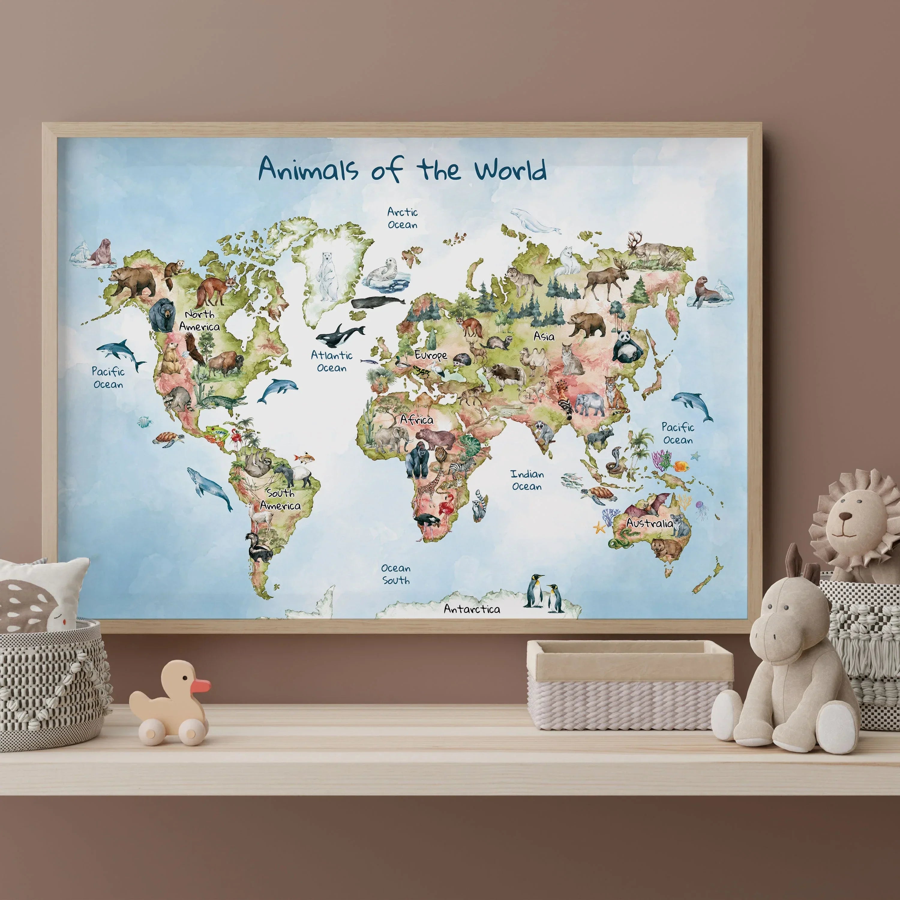 Illustrated world map poster titled 'Animals of the World,' featuring watercolor-style animal illustrations specific to each region and ocean, designed for a playful and educational touch.